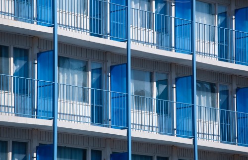 closeup-shot-apartment-building-with-blue-balcony-dividers (3)